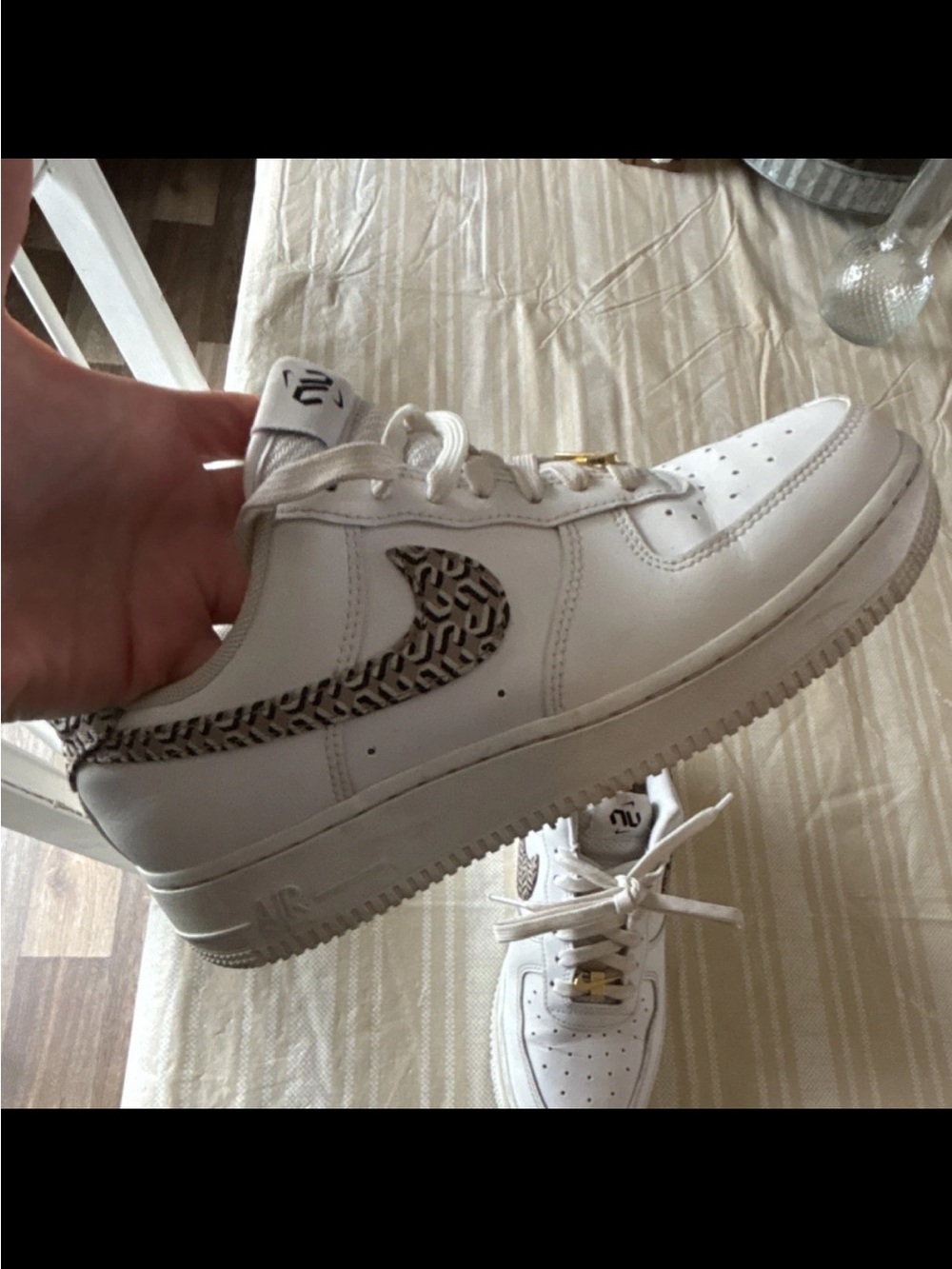Nike White Air Force 1 Low with Patterned Swoosh and Gold Accent